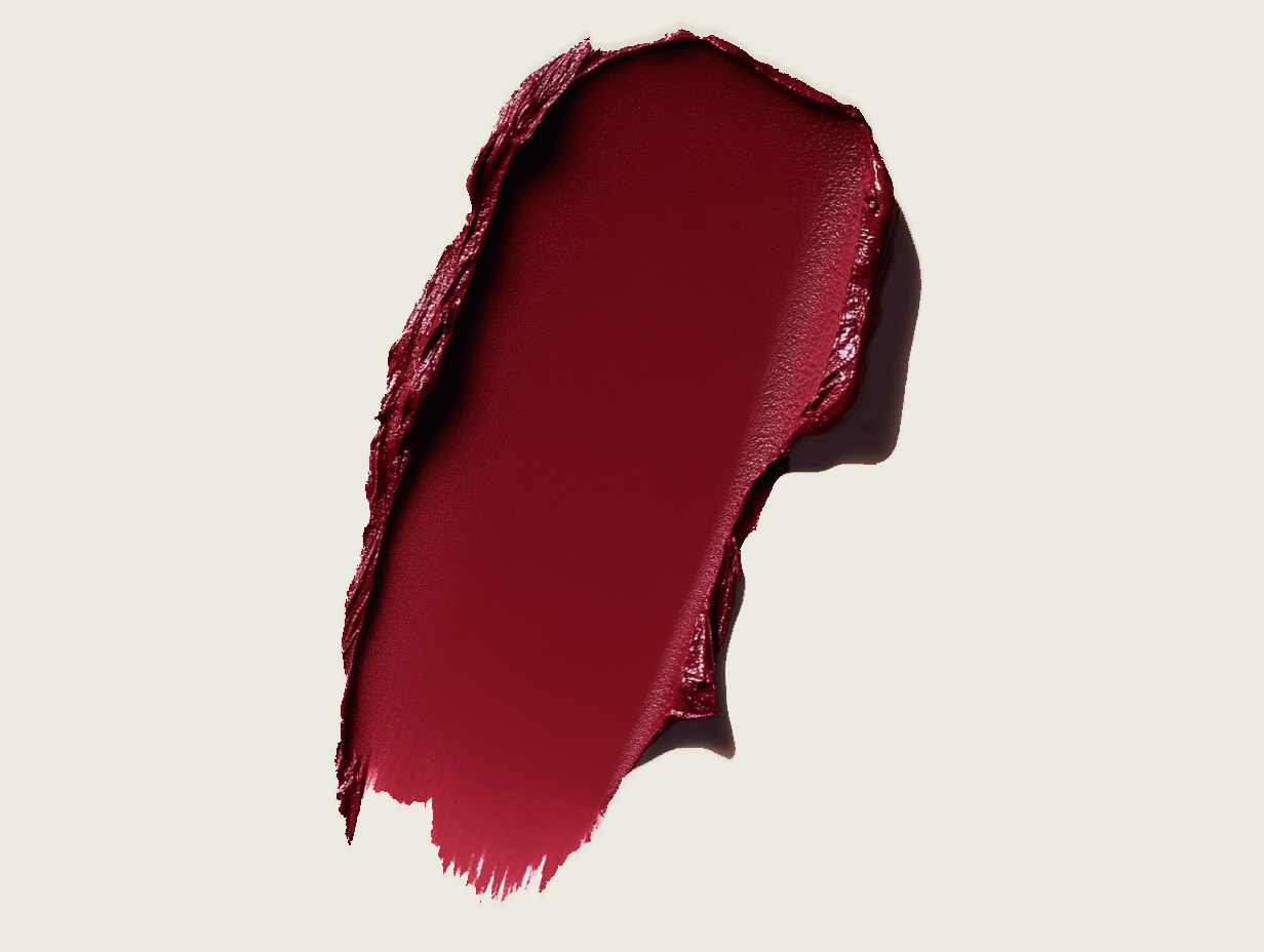 AI-generated deep burgundy lip color swatch on cream background, beauty editorial