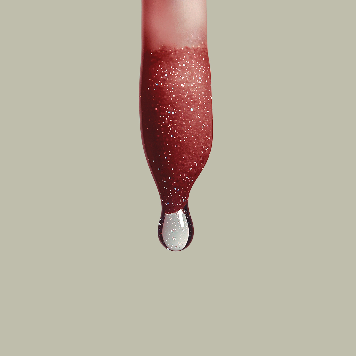 AI macro photograph of red glittery liquid lipstick droplet on sage green background, beauty editorial