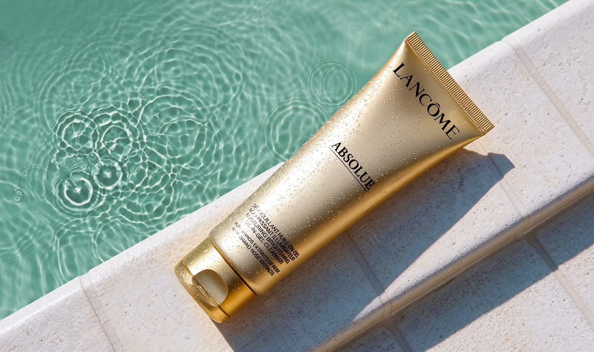 AI-generated gold skincare tube product on teal pool-inspired background, Adobe Firefly