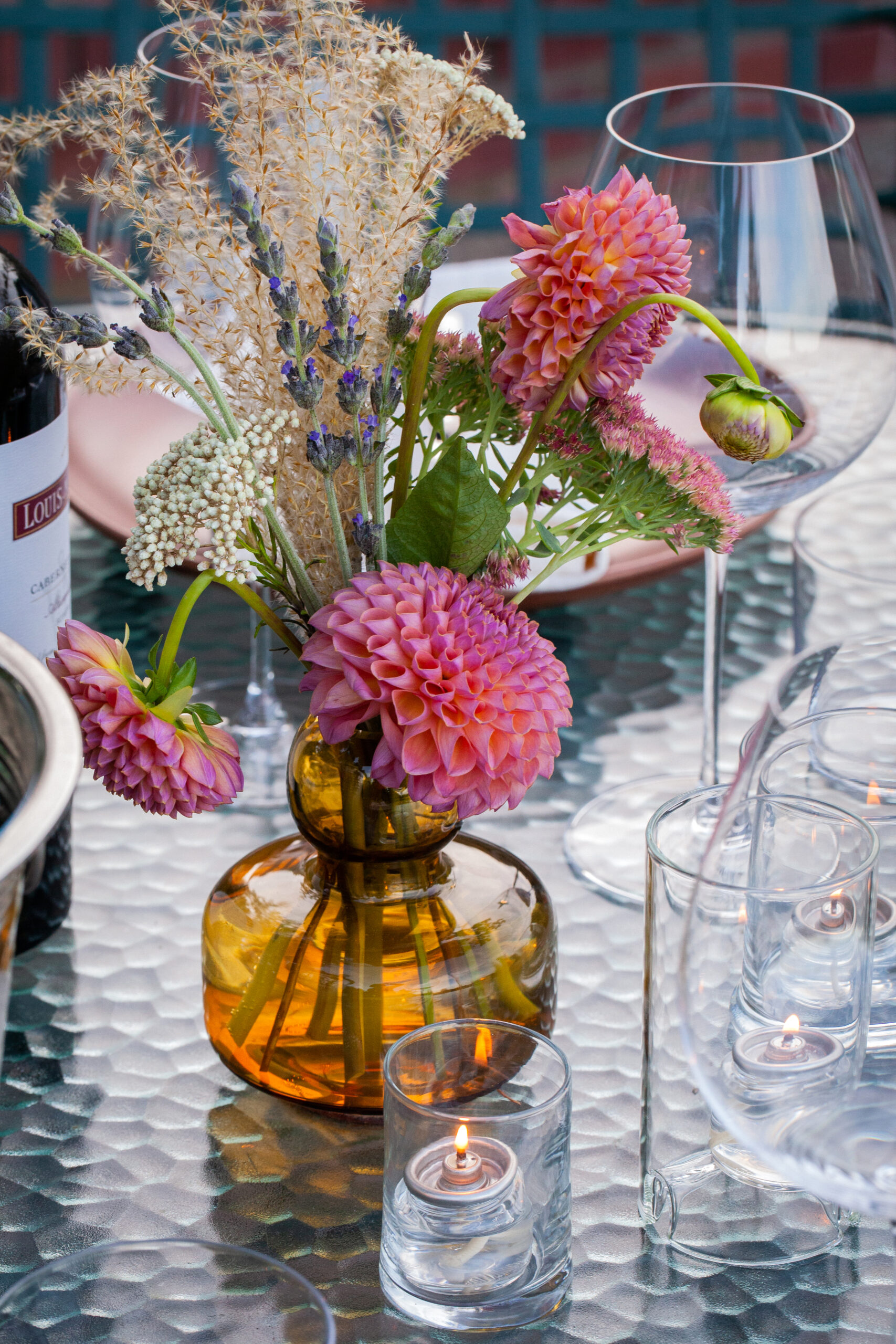 dahlia floral centerpiece candlelit outdoor dining table luxury editorial brand photography