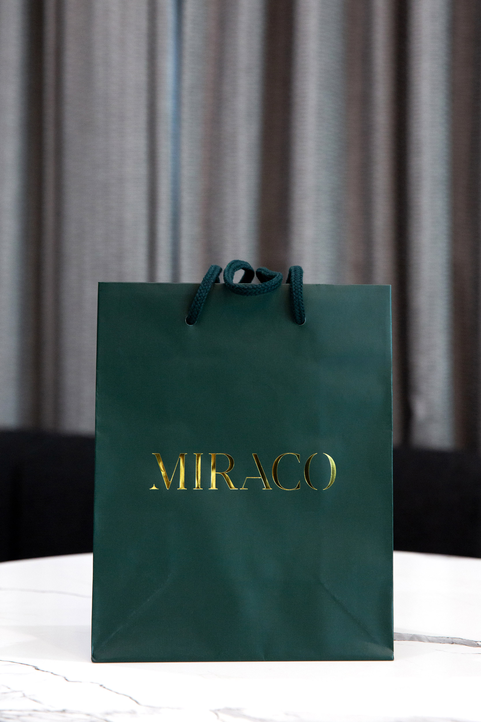 Miraco luxury green gold gift bag brand photography detail