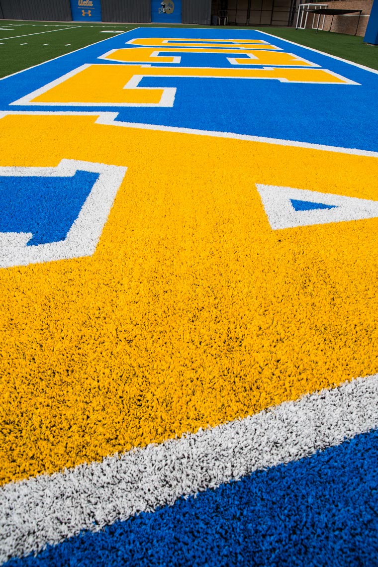 UCLA football field with blue and gold markings, graphic brand photography