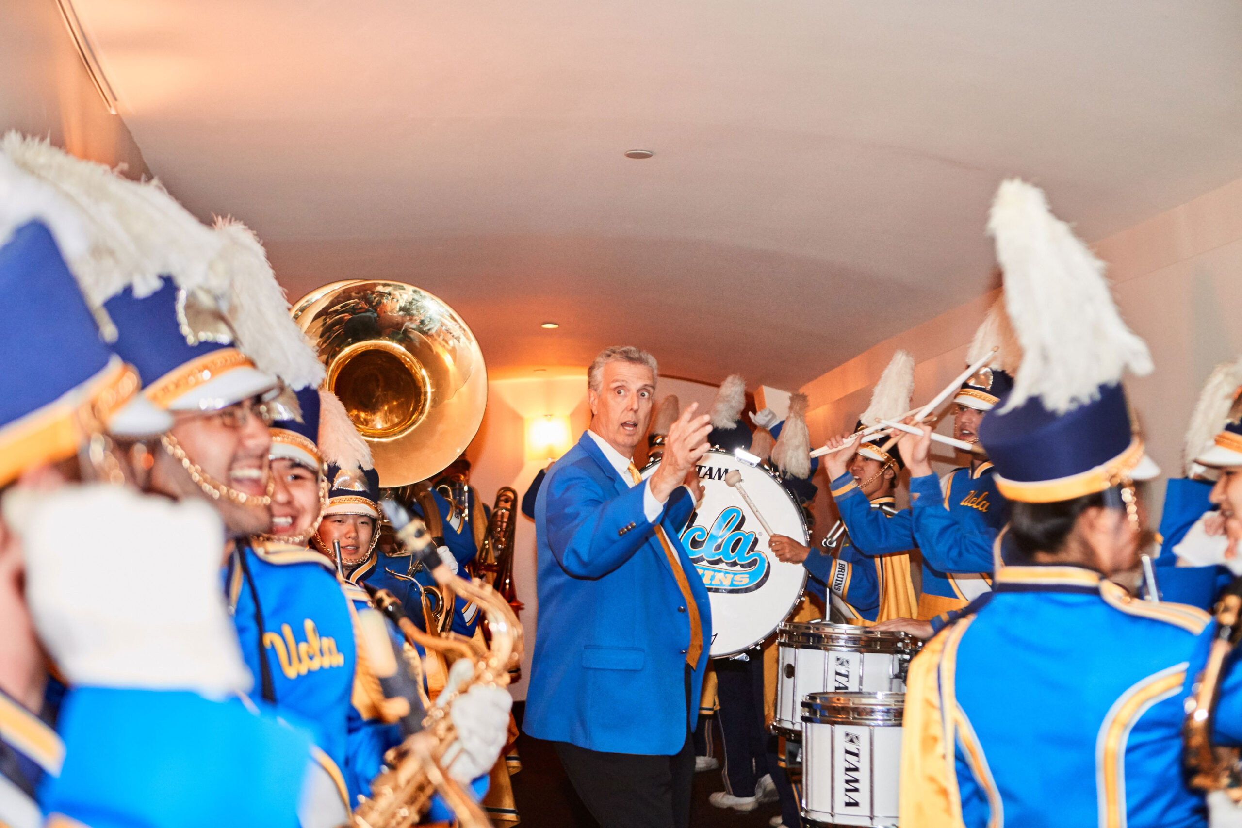 UCLA marching band performing at Thursday night event, brand event photography